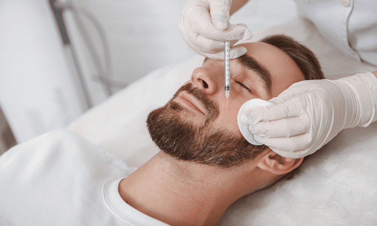 Man receiving facial injection treatment