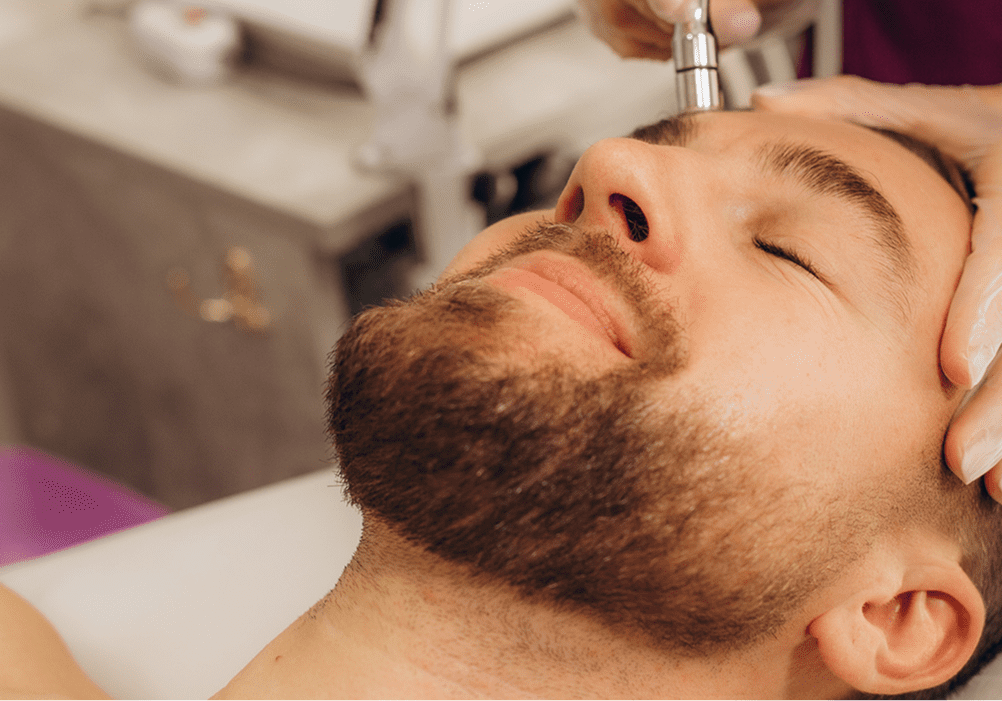 Spa professional performing facial treatment